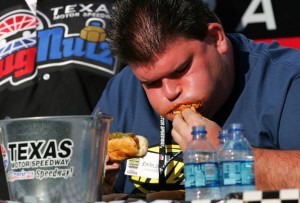 FORT WORTH, TX - JUNE 07:  James Deig, of Arlington Texas, competes in a hot dog eating contest, prior to the IRL IndyCar Series Bombardier Learjet 550k on June 7, 2008 at the Texas Motor Speedway in Fort Worth, Texas.  (Photo by Streeter Lecka/Getty Images)